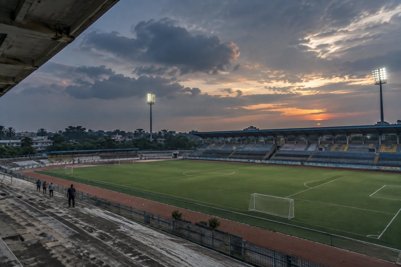Indian football stadium and pitch at dusk